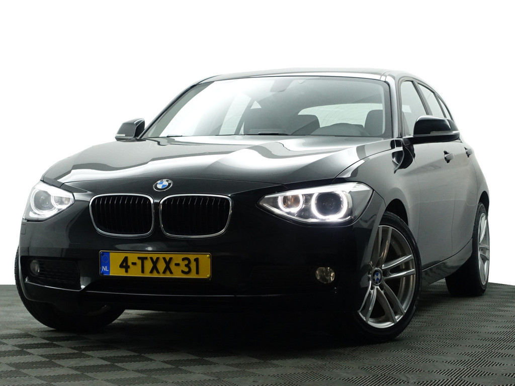 
								BMW 1-serie 116i High Executive Aut- Xenon Led, Park Assist, Dynamic Select, Navi, Clima, Cruise vol									